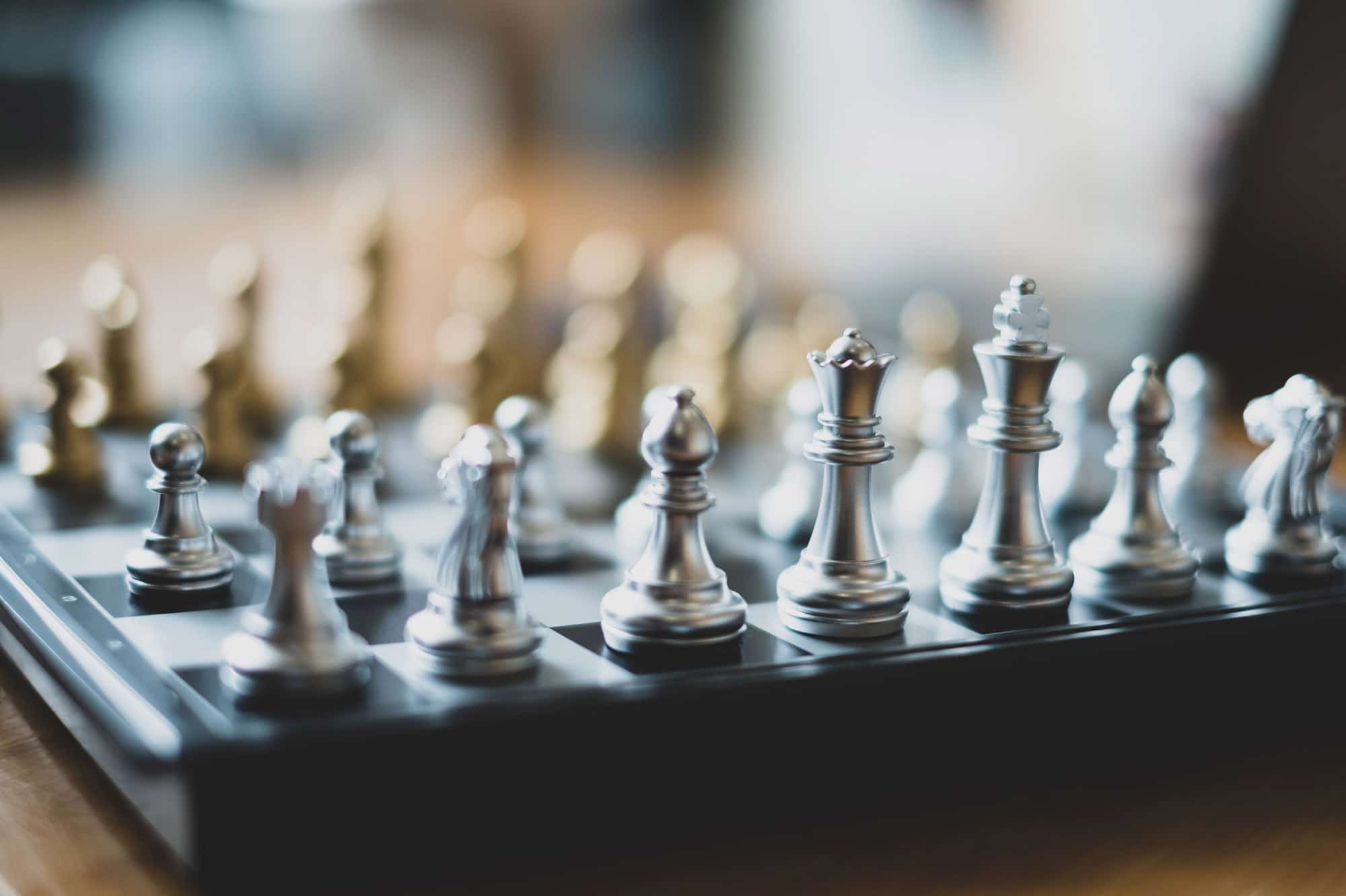 Four,Well,Dressed,Professionals,Walk,Down,Steps,In,Discussion,Outside Chess board